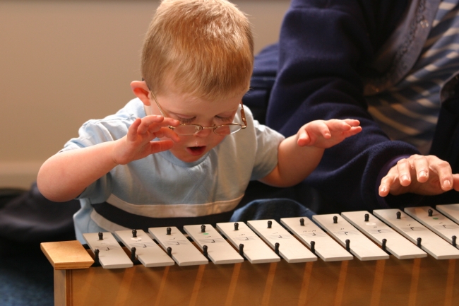 Picture of a boy playing a xylophone