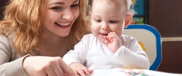 Picture of a mother reading to her daughter