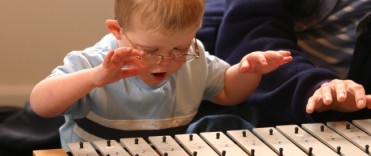 Picture of a boy playing a xylophone